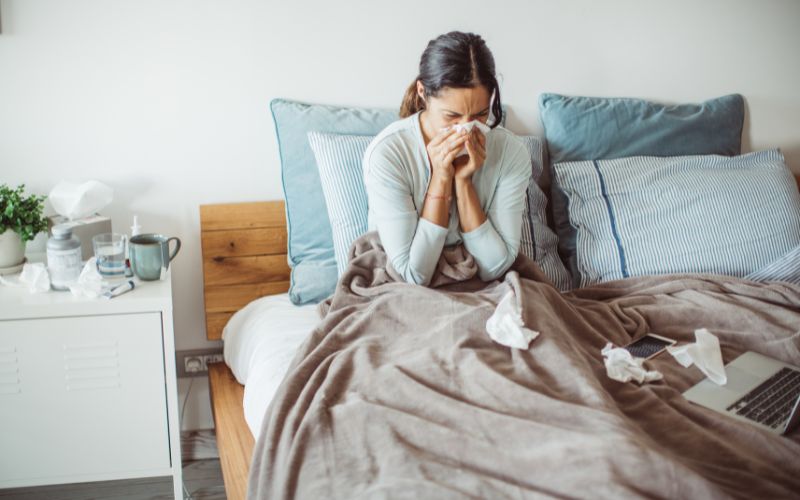 Lady in bed suffering FLUE